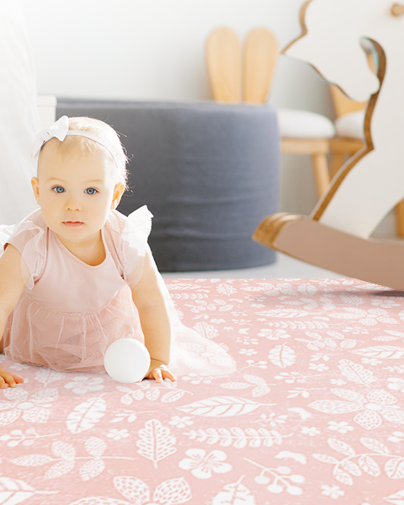 Tranquil Flower - Baby Coral play mat in a portrait family floor-time scene