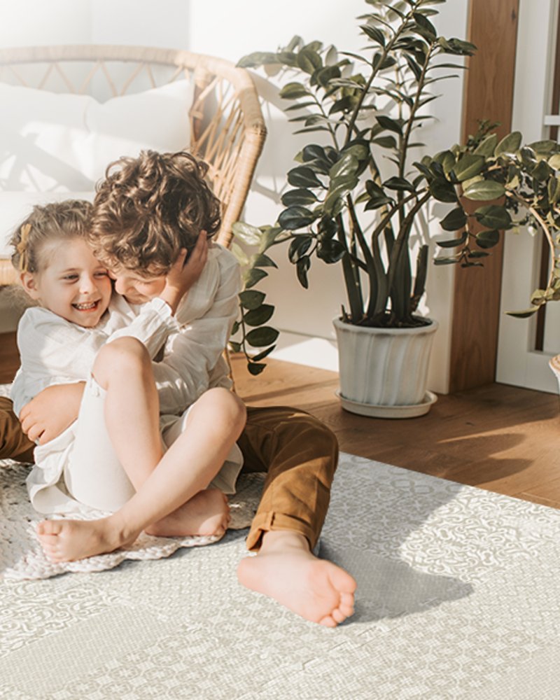 Totem - Beige play mat in a portrait family floor-time scene