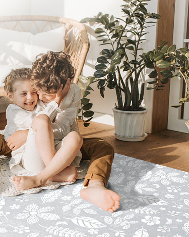 Tranquil Flower - Gray play mat in a portrait family floor-time scene